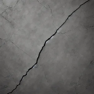 Dall·e 2025 03 28 16.12.25 A Realistic, High Resolution Photo Of A Subtle Hairline Crack In A Tough, Solid Concrete Floor, Viewed Directly From Above. The Surface Is Completely